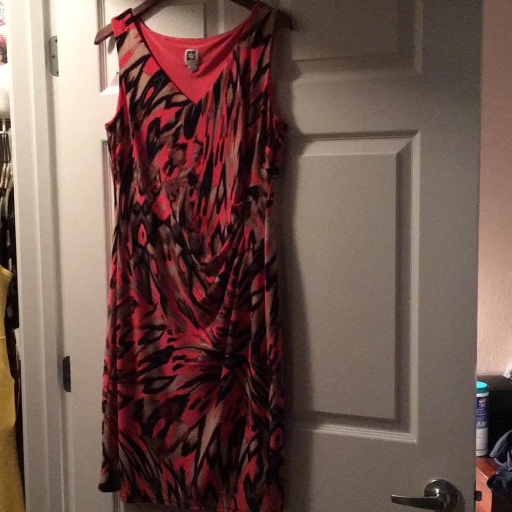 Coral dress with animal print accents.